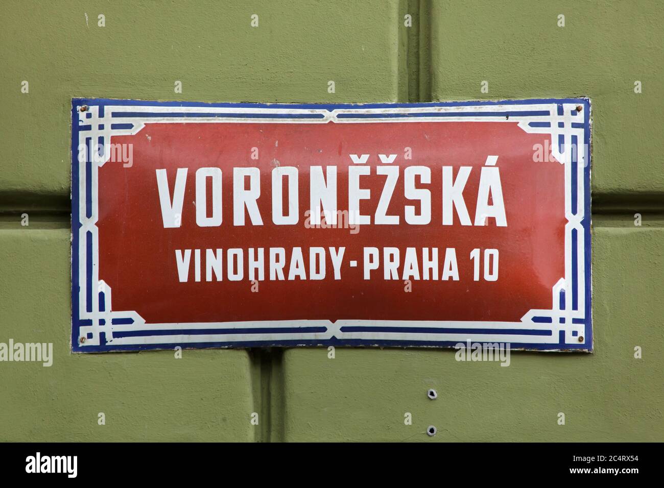 Voroněžská Street. Traditional red street sign in Vršovice district in Prague, Czech Republic. The street is named after the city of Voronezh (Voroněž) in Russia. Stock Photo