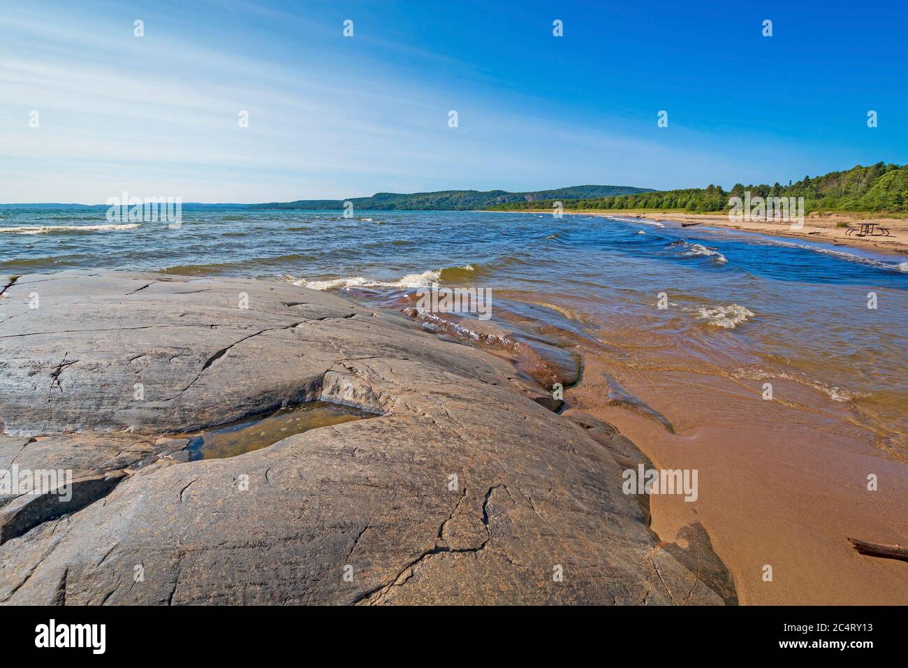 Polished Rocks and Sand on a Remote Shore of Lake Superior in Neys