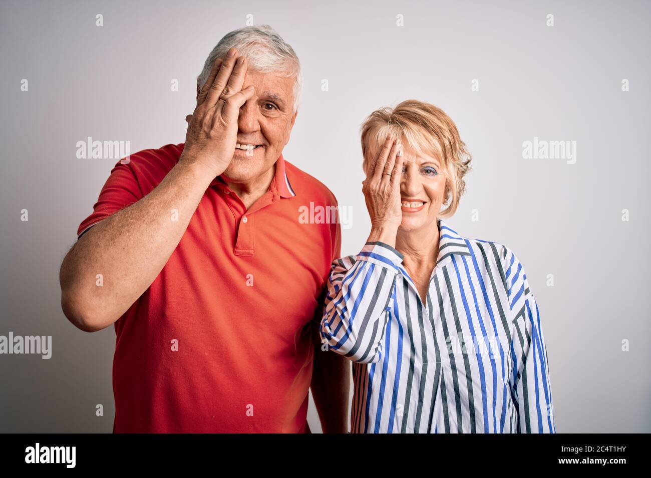 Senior beautiful couple standing together over isolated white ...