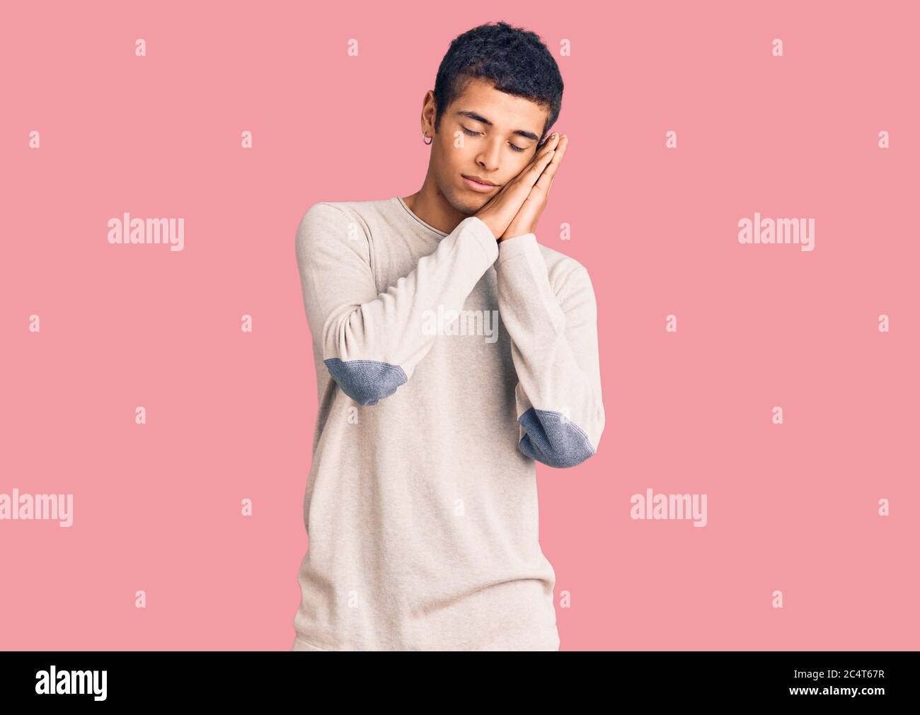 Young african amercian man wearing casual clothes sleeping tired ...