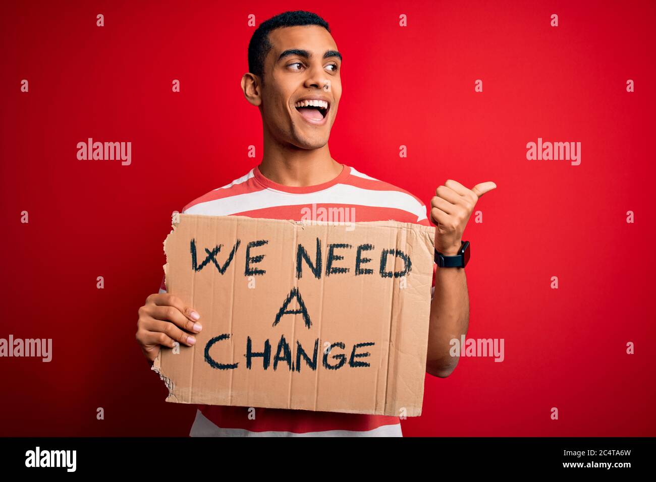 Young handsome african american activist man asking for change holding ...