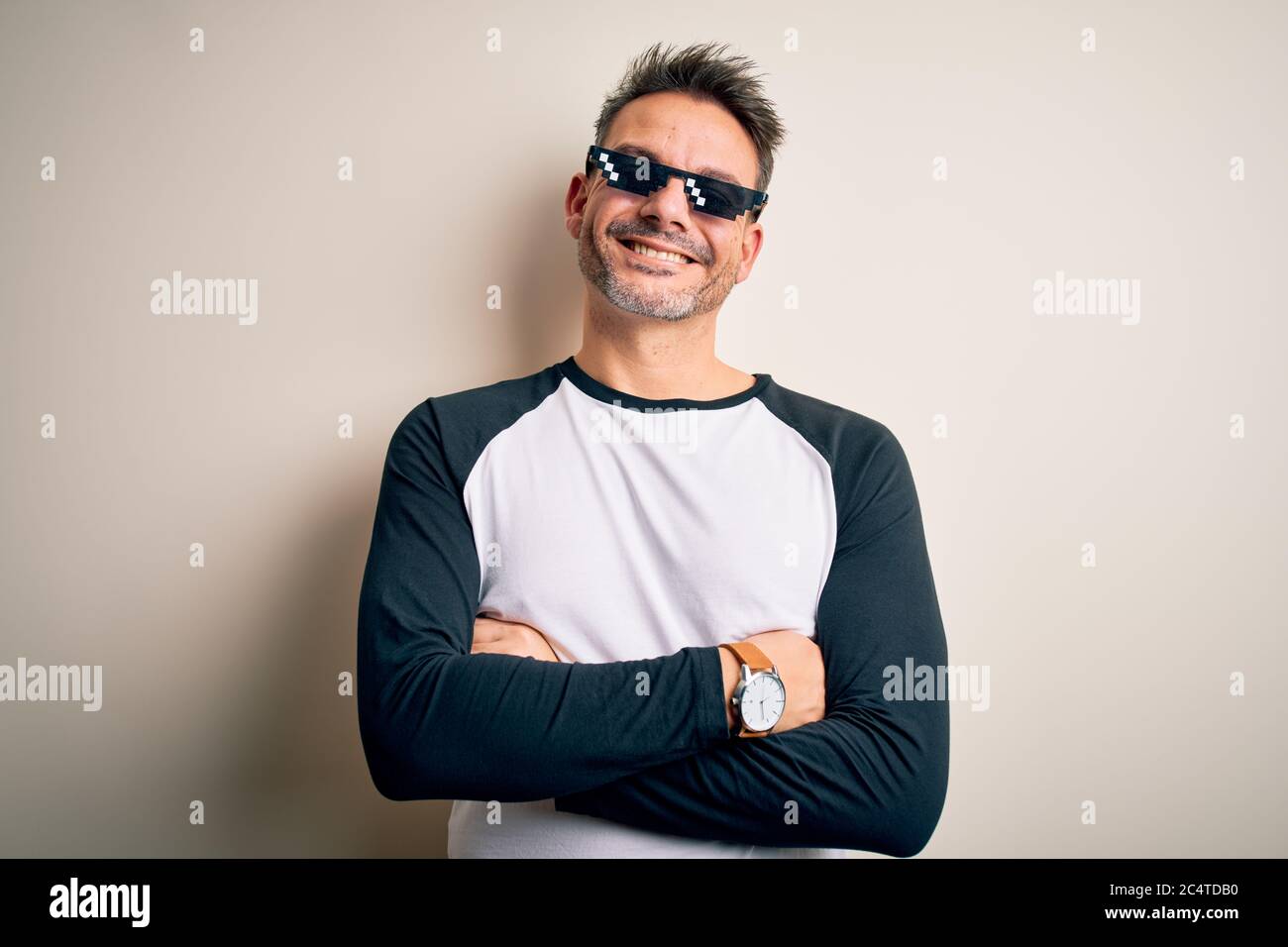 Young handsome man wearing funny thug life sunglasses meme over white  background happy face smiling with crossed arms looking at the camera.  Positive Stock Photo - Alamy