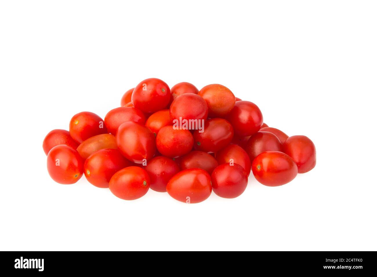 Closeup shot of fresh cherry tomatoes isolated on a white background ...