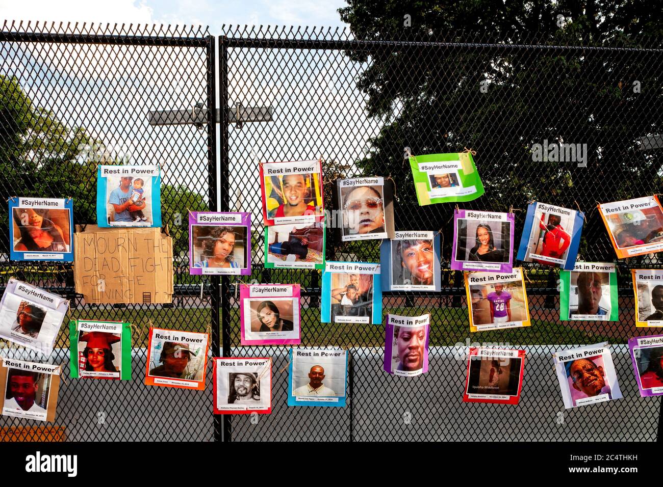 Photos of victims of murdered by police hang on the fence around Lafayette Square and the White House, Washington, DC, United States Stock Photo