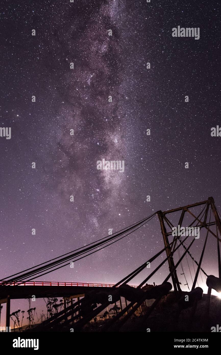 Vertical shot of a bridge under the starry sky Stock Photo - Alamy