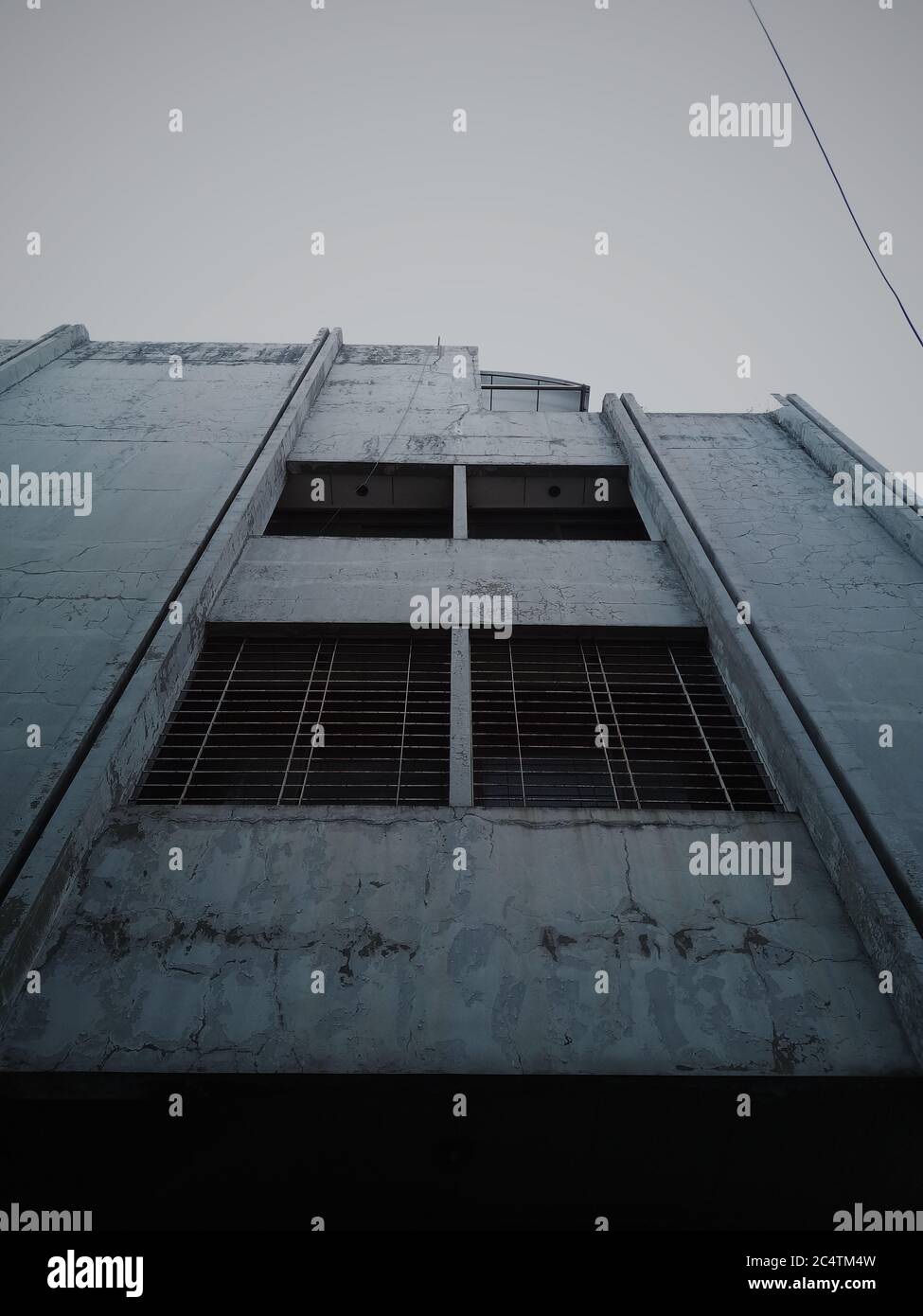 Vertical low angle shot of an old white building Stock Photo - Alamy