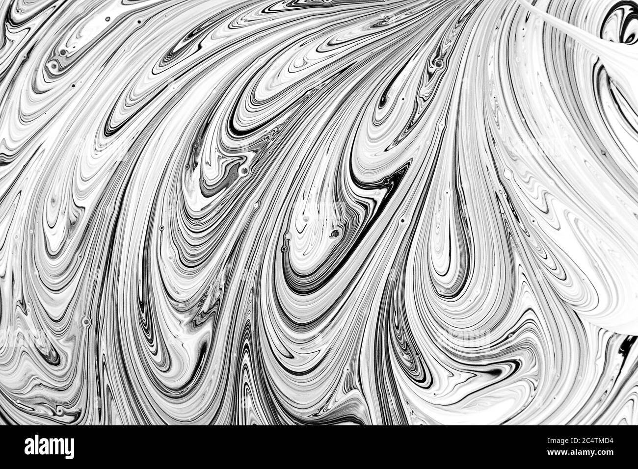 Mixing paints abstract background, marbleized effect, black and white