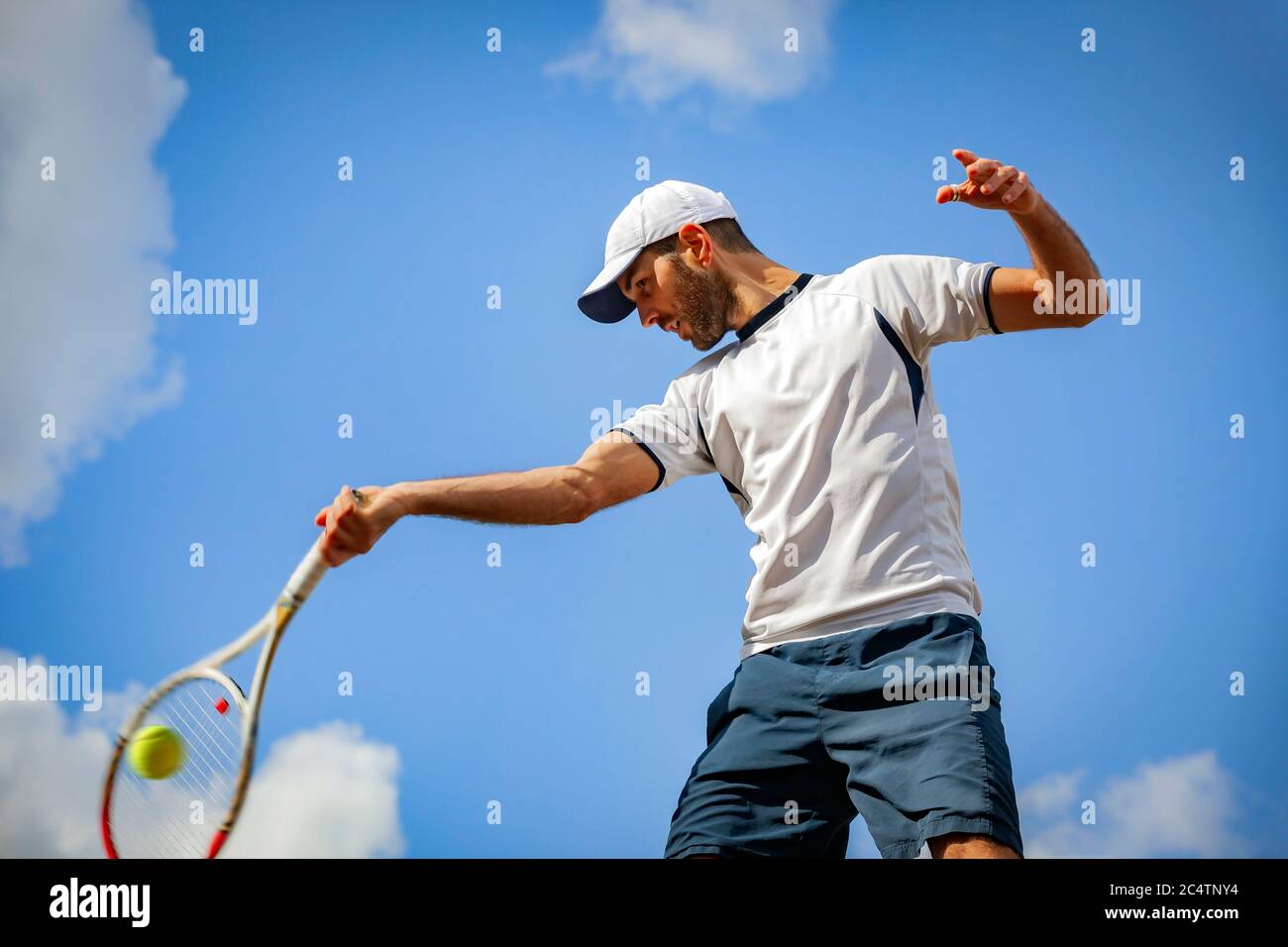 male tennis player in action Stock Photo