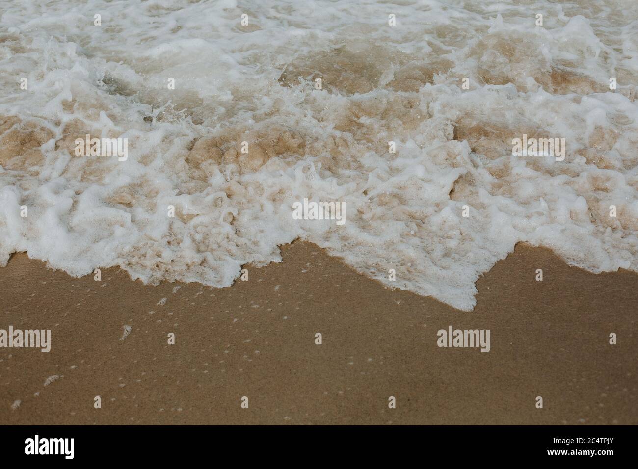 High angle shot of waves reaching a sandy beach - perfect for wallpaper ...