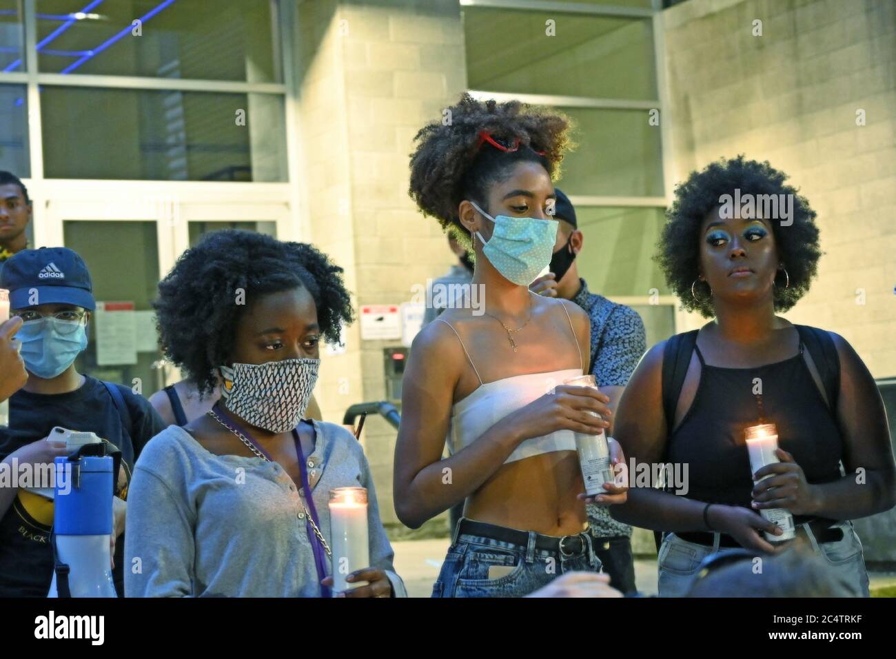 June 24 2020. Seattle WA. BLM protesters at CHAZ are holding candles and mourning the lives taken by violence. Majority is wearing face masks. Stock Photo