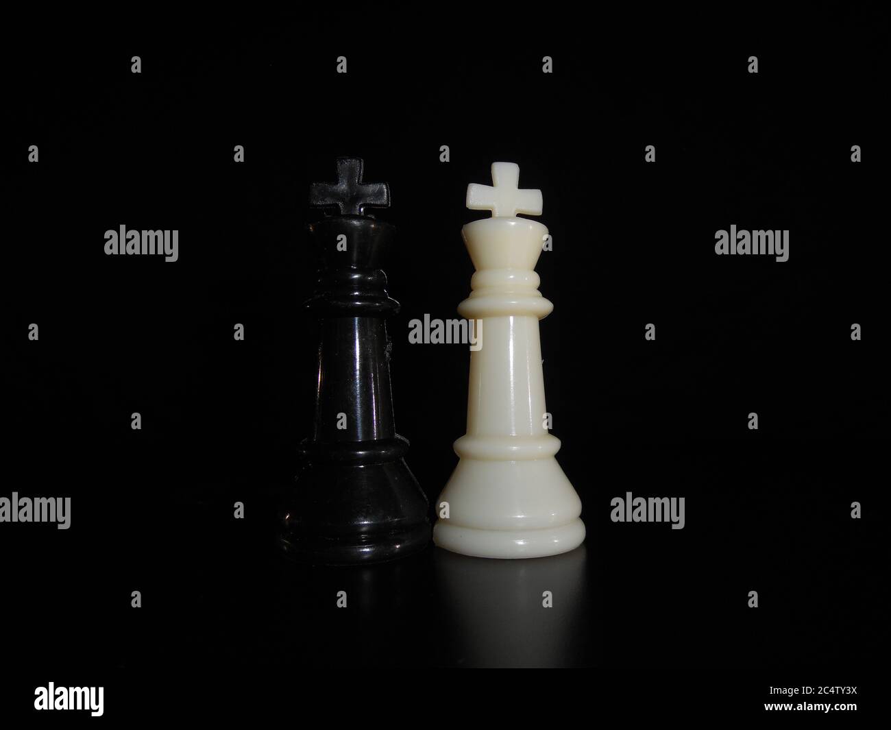 Chess photographed on portrait of black background. Stock Photo