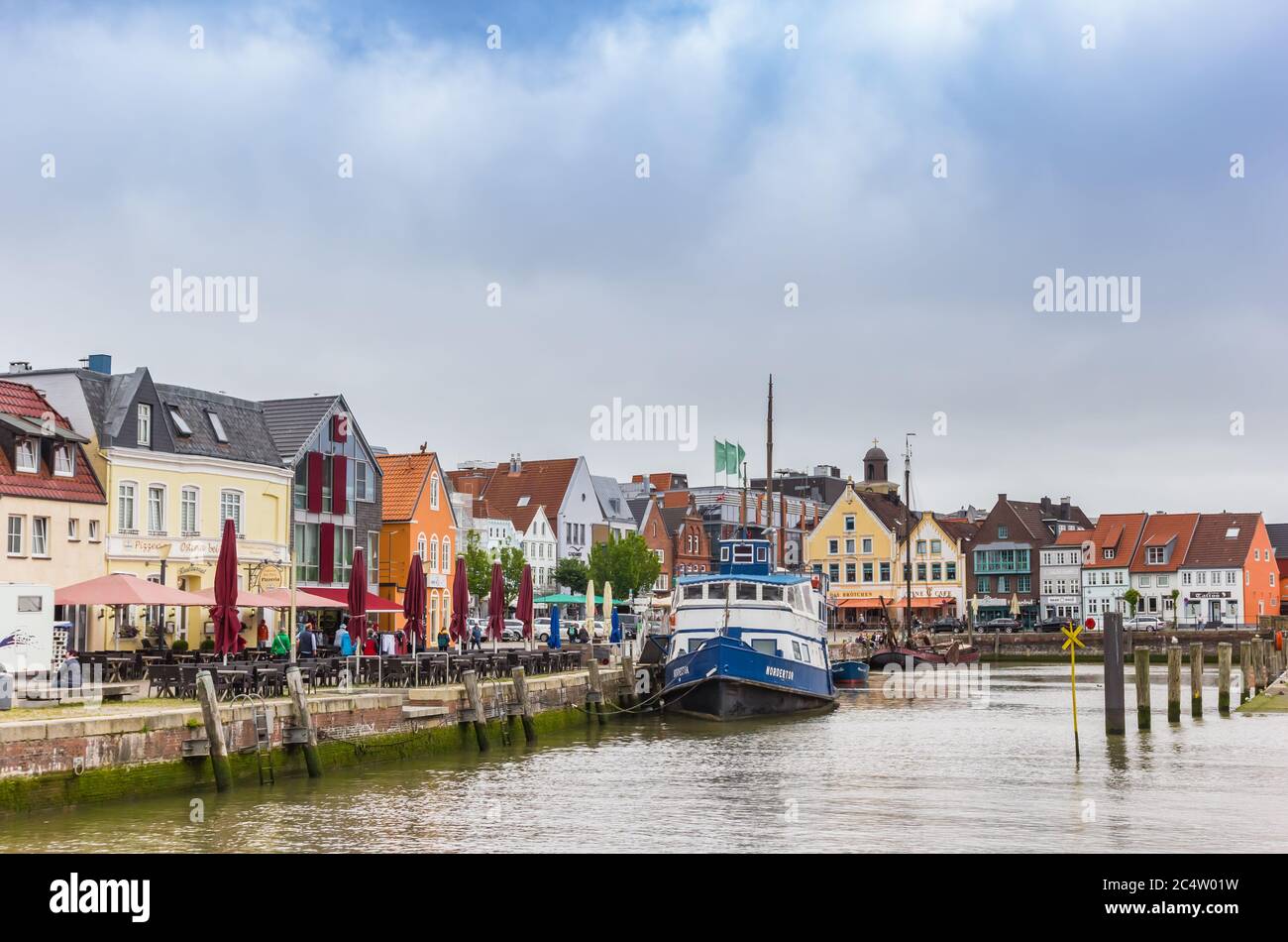 Boat at the quayside of the old harbor in Husum, Germany Stock Photo