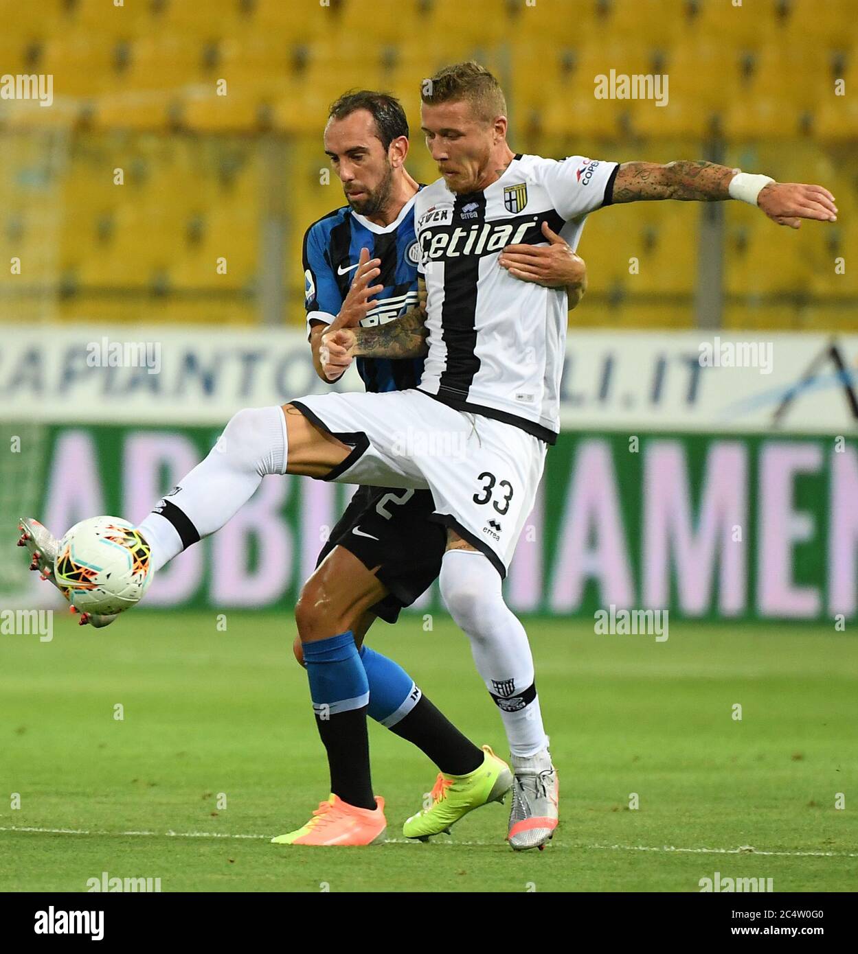 Parma, Italy. 28th June, 2020. Inter Milan's Diego Godin (L) vies with Parma's Juray Kucka during a Serie A match between Parma and Inter Milan in Parma, Italy, June 28, 2020. Credit: Alberto Lingria/Xinhua/Alamy Live News Stock Photo