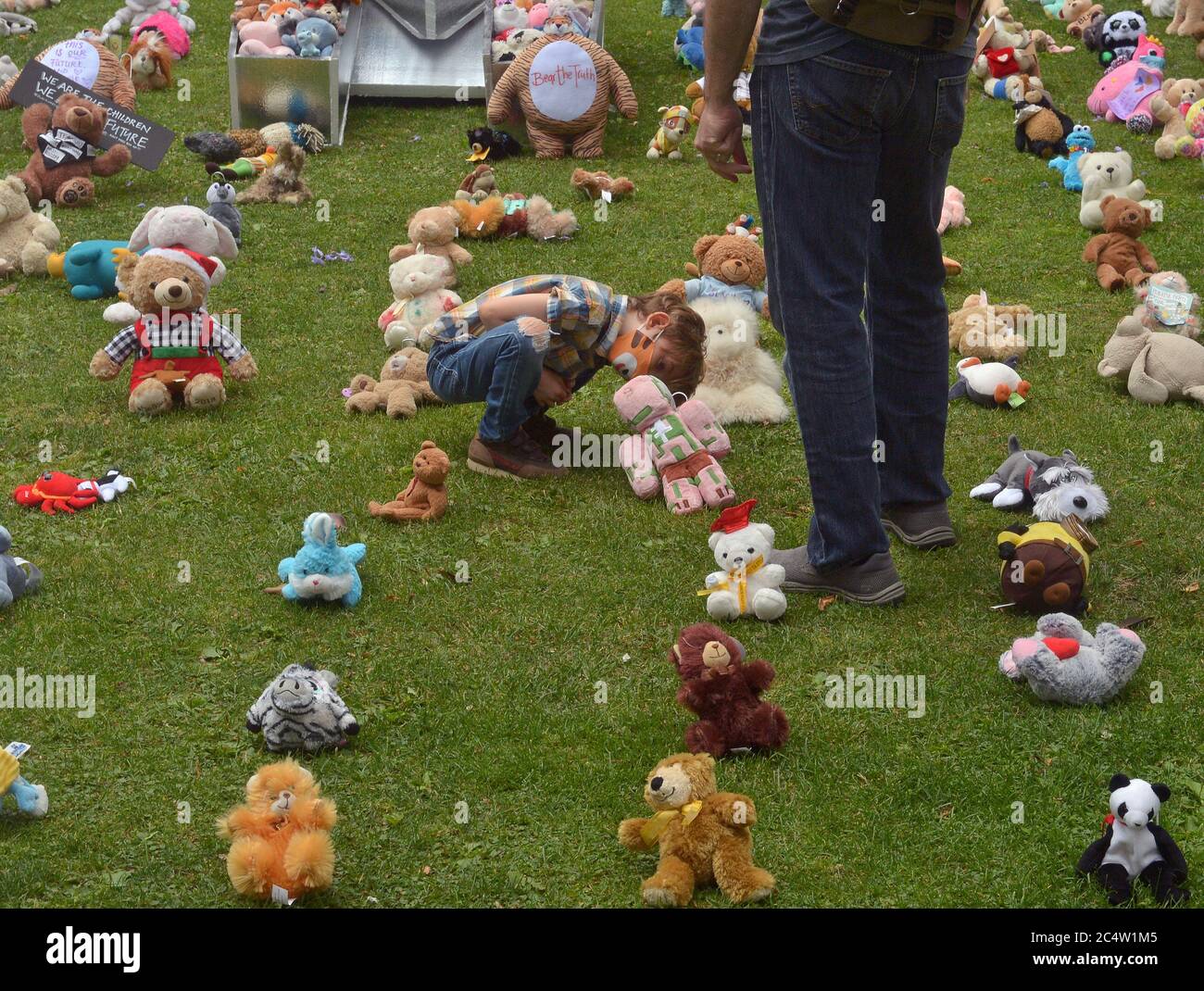 Los Angeles, United States. 29th June, 2020. A young boy and his father look over display of teddy bears with the message, 'we deserve a future free of racial injustice' in Los Angeles on Sunday, June 28, 2020. Demonstrations and other activities across the nation, targeting systemic racism and police brutality have entered a second month with no signs of waning. Photo by Jim Ruymen/UPI Credit: UPI/Alamy Live News Stock Photo