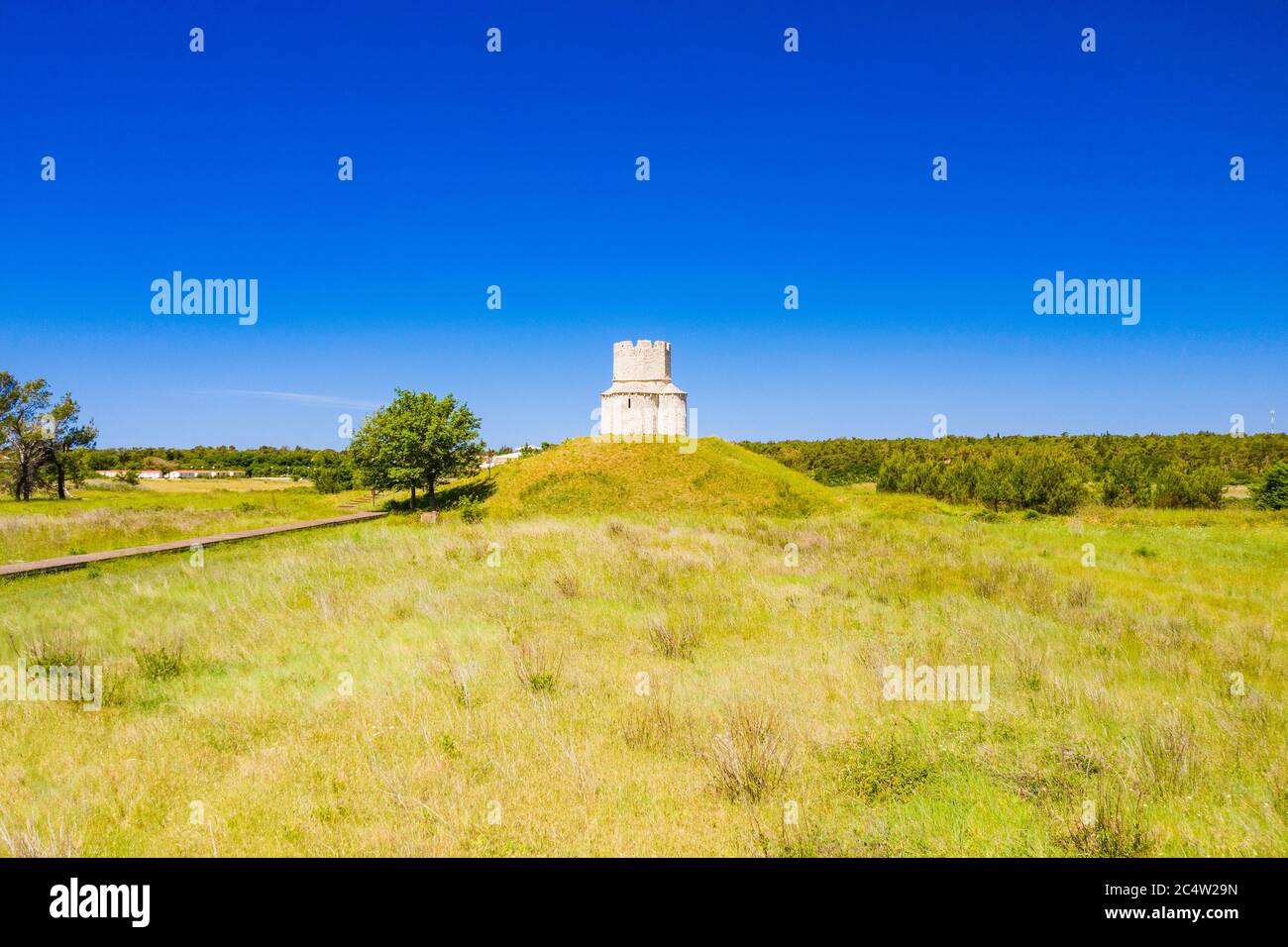 Medieval stone church of St. Nicholas (Sveti Nikola) from 12th century near Nin, Dalmatia, Croatia, drone view Stock Photo