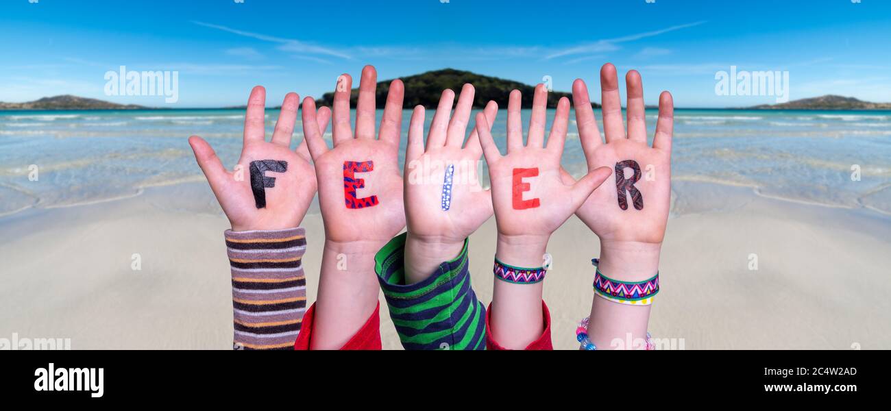Children Hands Building Word Feier Means Celebration, Ocean Background Stock Photo