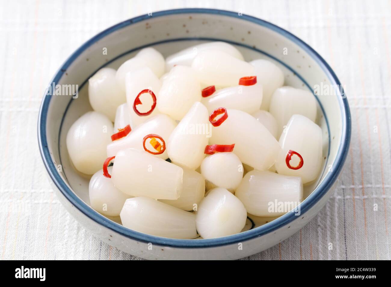 Japanese Rakkyo, Sweet and sour pickled scallions in a dish Stock Photo