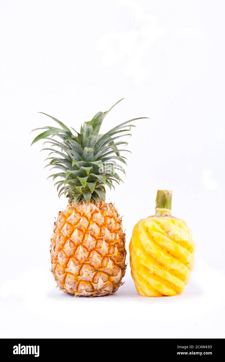 peeled  pineapple and ripe pineapple  on white background healthy pineapple fruit food isolated Stock Photo