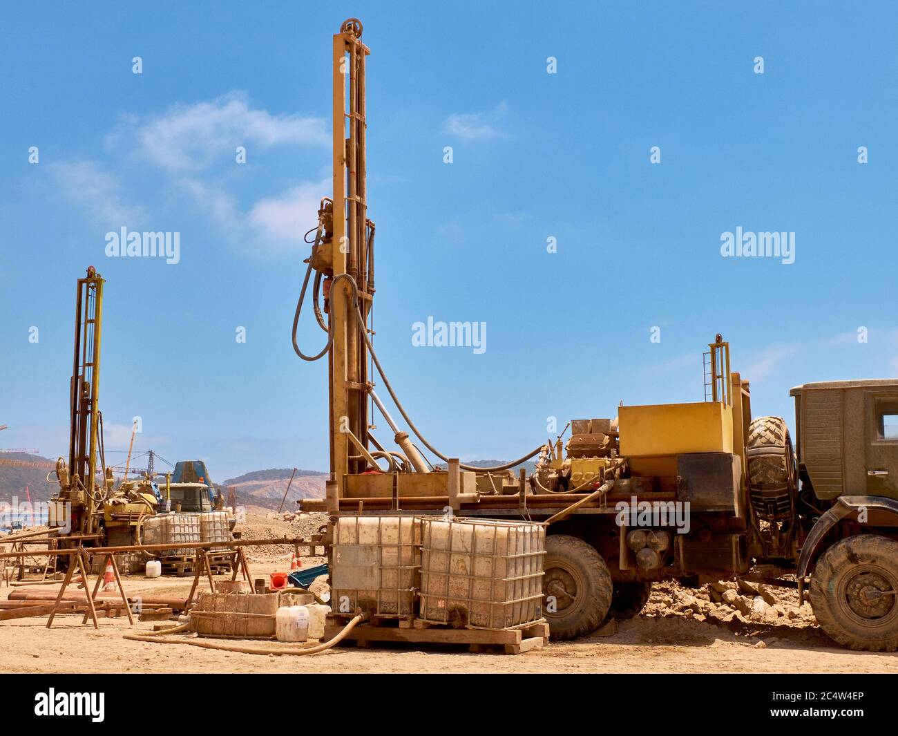 Mobile drilling rigs on vehicles at construction site Stock Photo Alamy