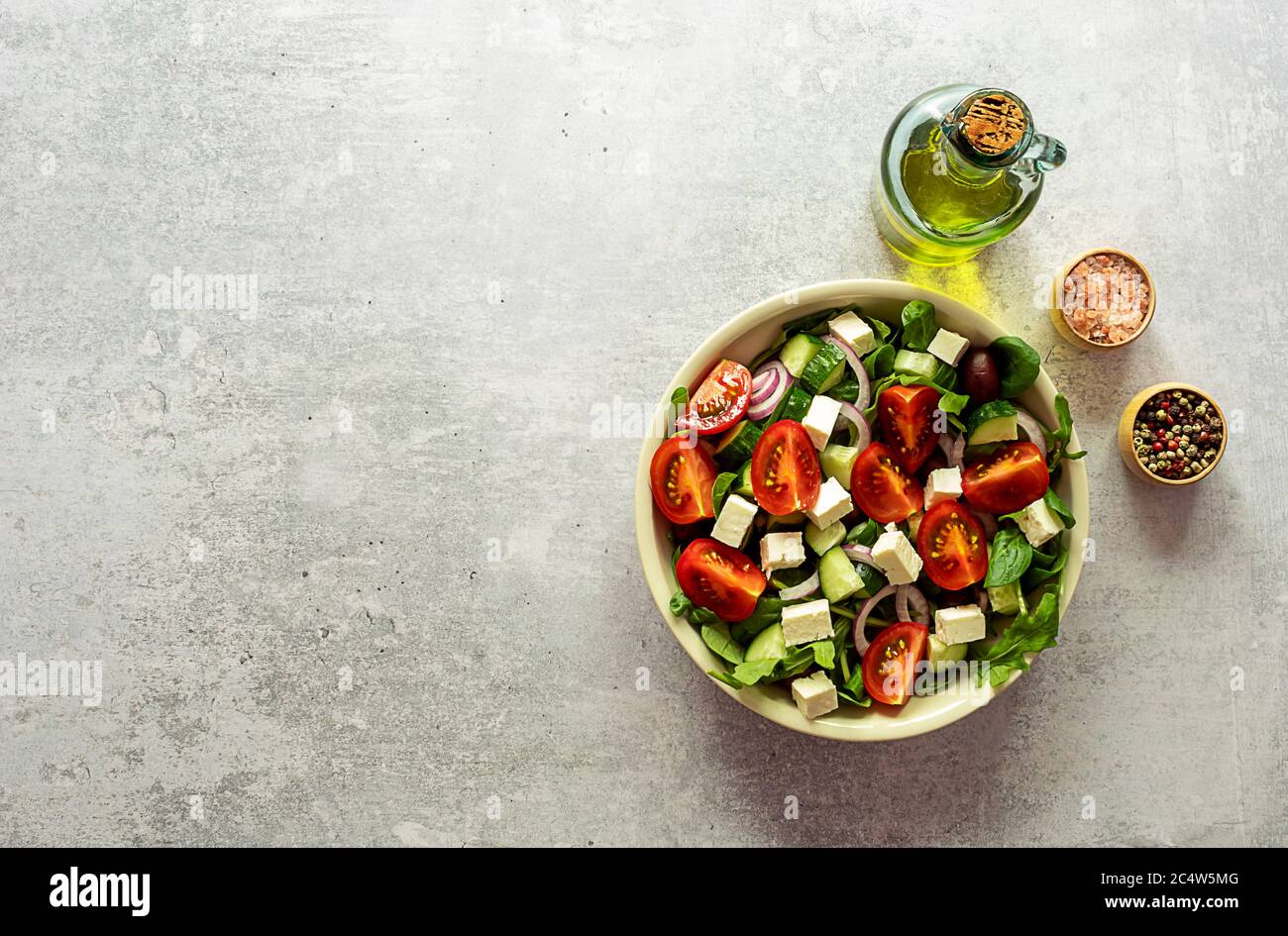 Traditional greek salad of fresh cucumber, tomato, lettuce, red onion