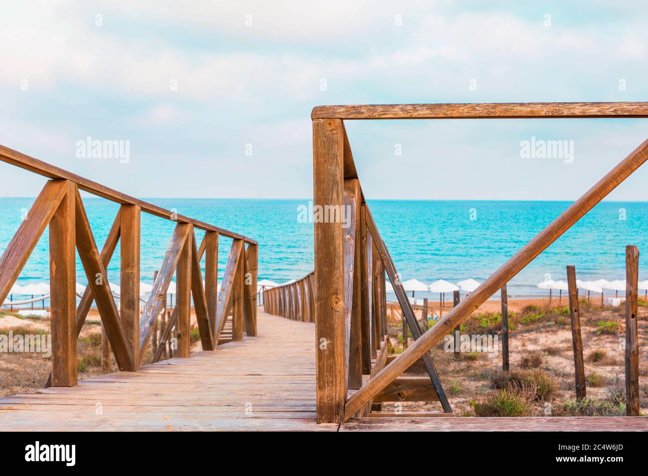 view of Guardamar beach in alicante spain through the wooden access to the beach Stock Photo