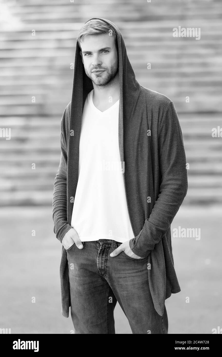 dangerously handsome. man in hood. hooligan wear hoodie. looking like thief in hooded cardigan