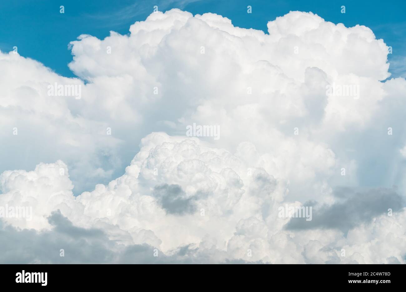 White fluffy clouds on blue sky. Soft touch feeling like cotton. White puffy clouds cape with space for text. Beauty in nature. Close-up white cumulus Stock Photo