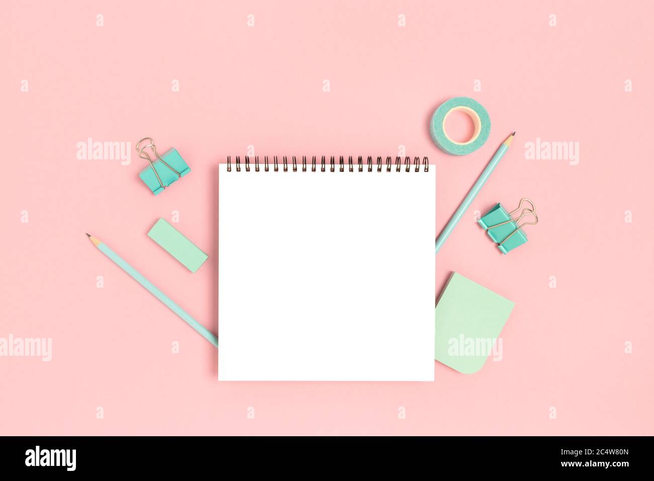 Notepad template with mint stationery on a pink pastel background ...
