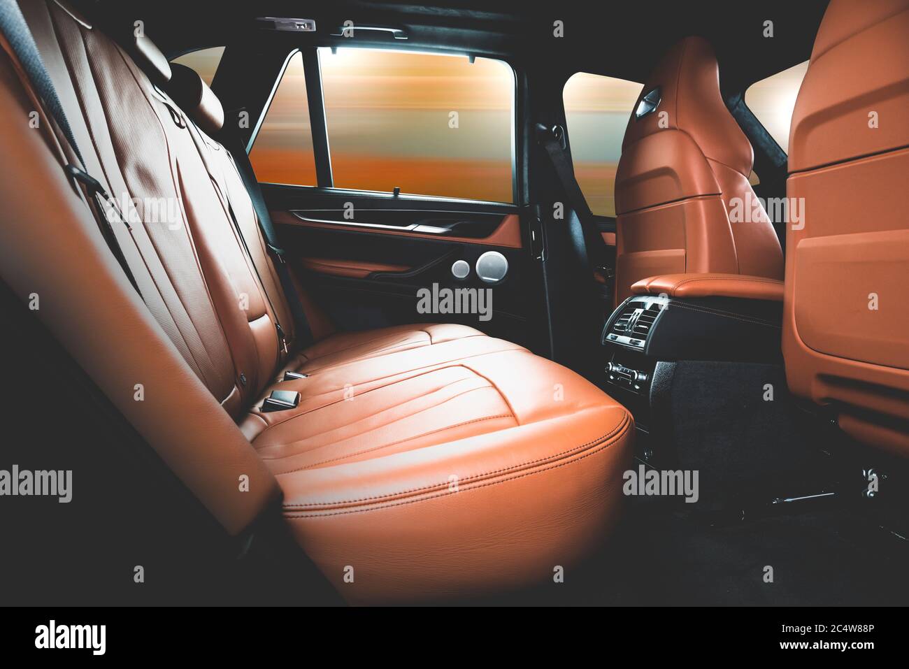 Back passenger seats in modern luxury car, red sand leather Stock Photo