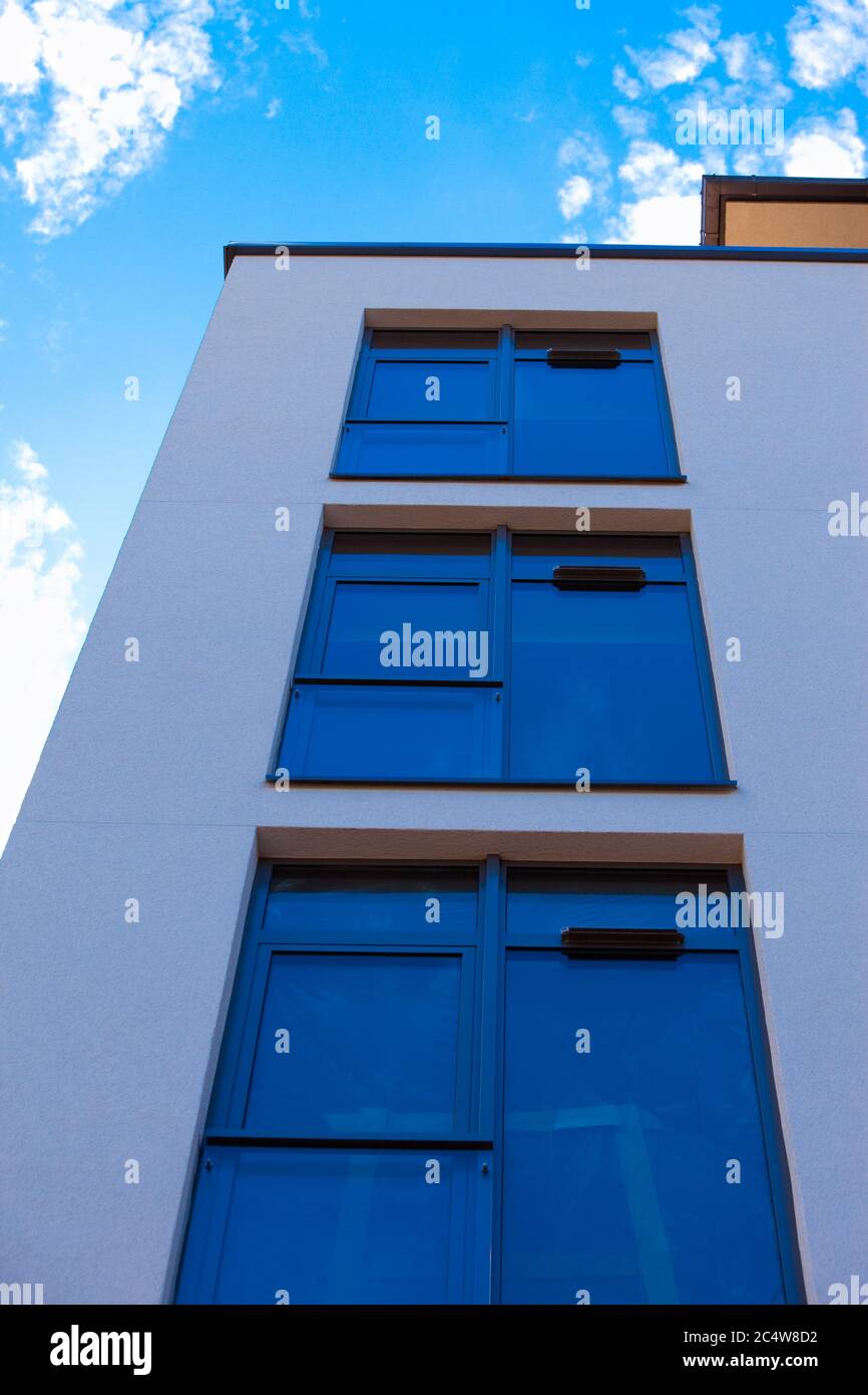 Low angle shot of a modern building under the blue sky Stock Photo - Alamy