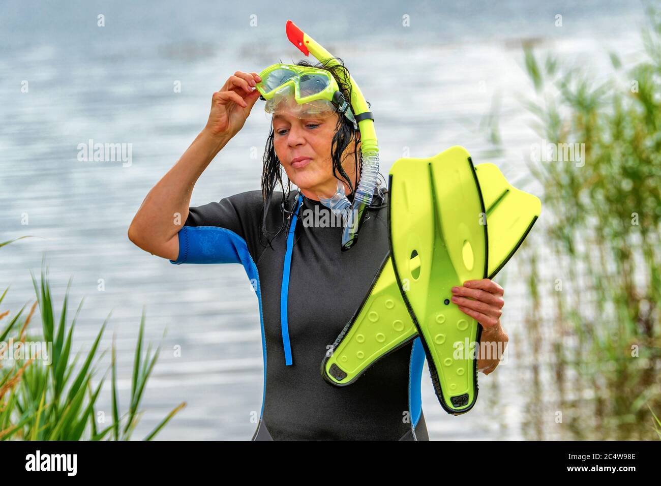 Woman comes back from snorkeling Stock Photo