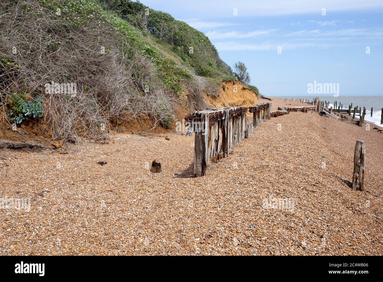 Remnants of old coastal defences and groins most 1940s anti-invasion military structures, Bawdsey, Suffolk, England, UK Stock Photo