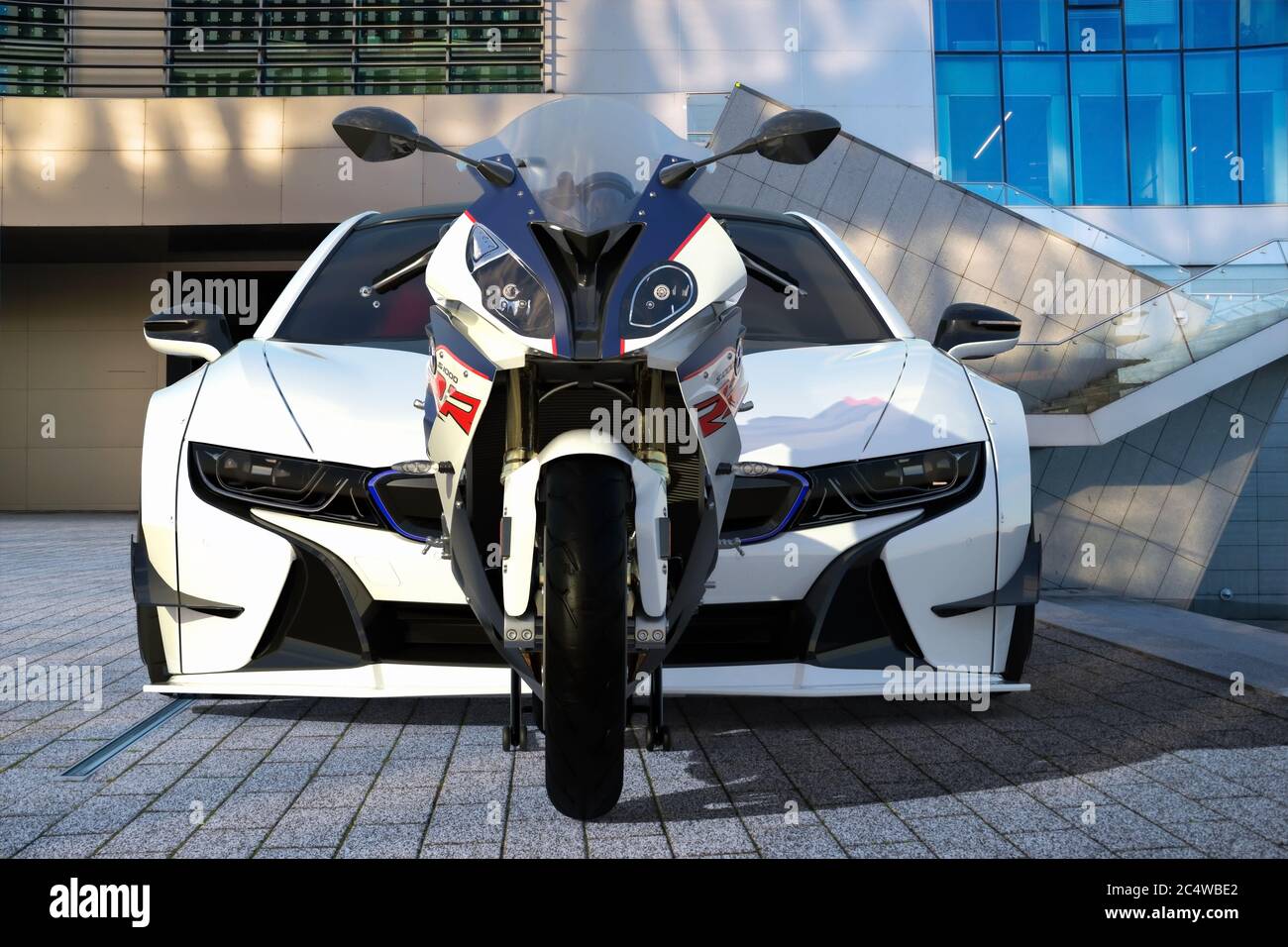 BMW S1000RR motorcycle versus BMW I8 electric sports coupe Stock Photo