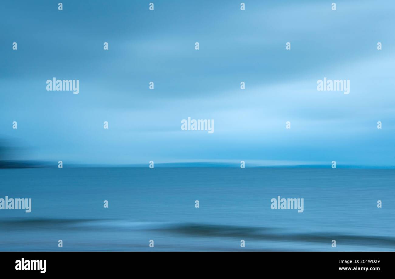 Abstract image of blue sea waves and clouds. Image captured using