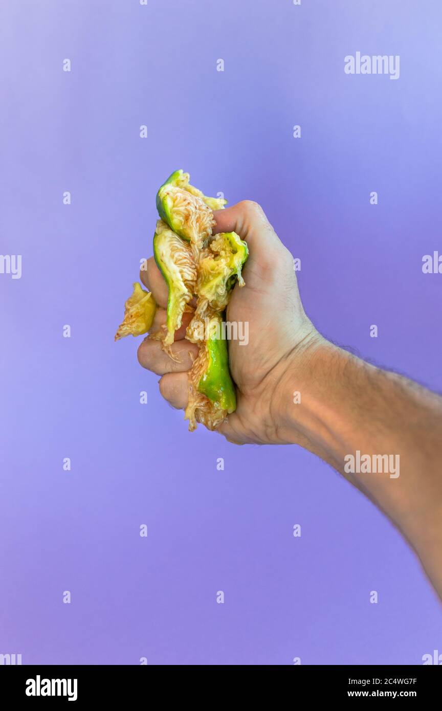Hand crushing fruit hires stock photography and images Alamy