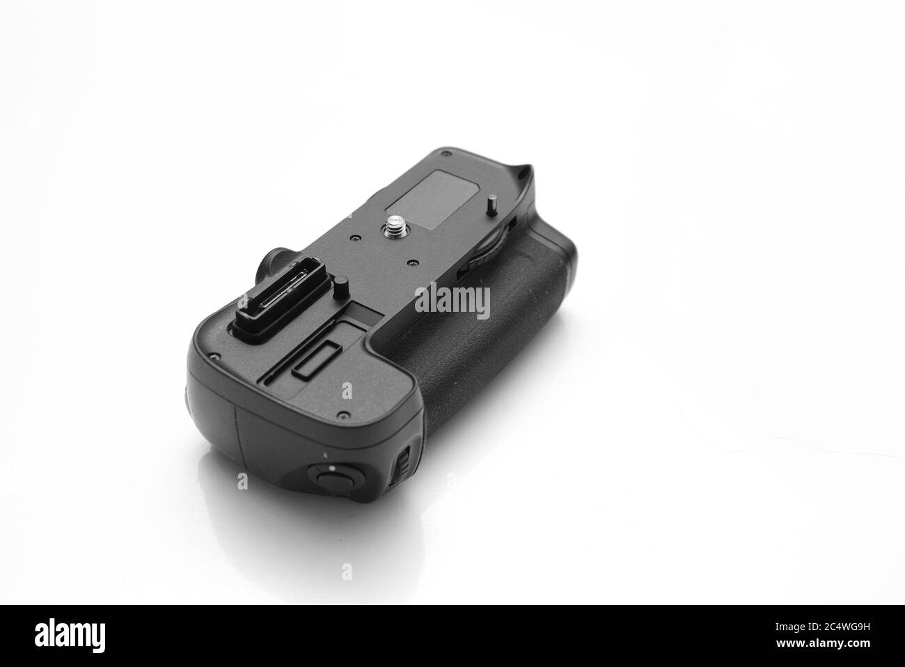 Battery Grip for Nikon DSLR Cameras isolated on white background. Stock Photo