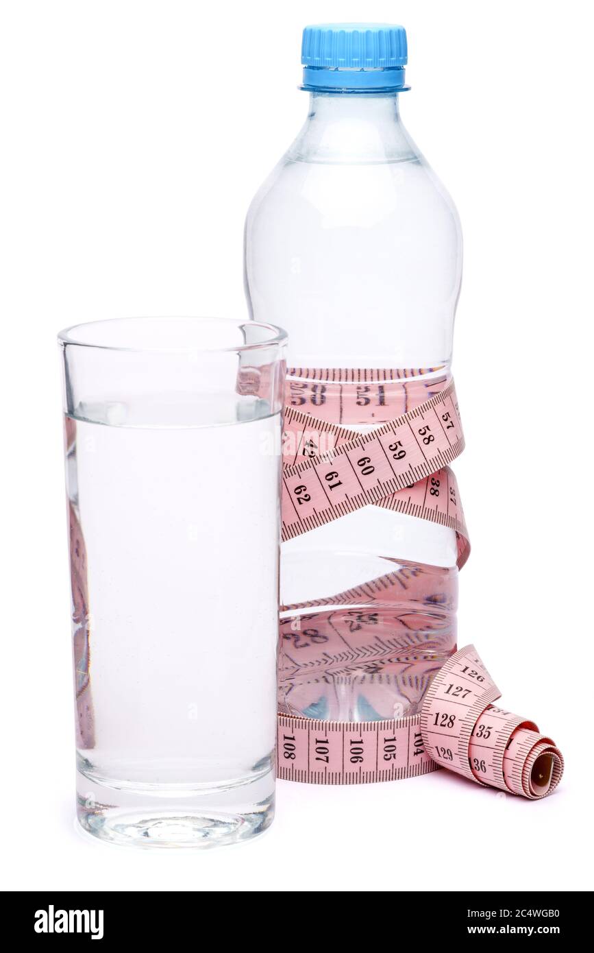 tape measure and mineral water bottle isolated on a blue