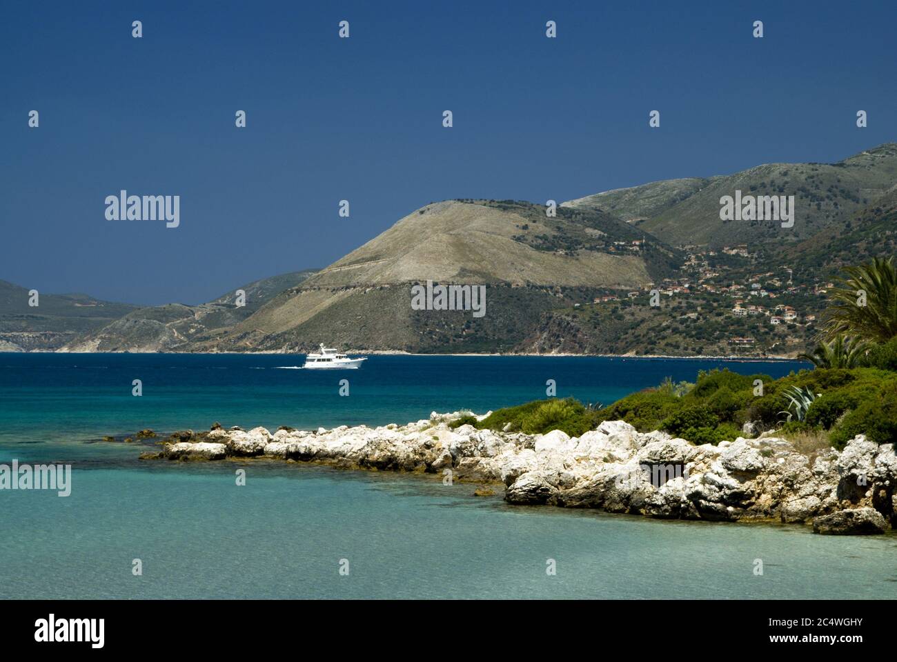Beach with mountains in distance, Fanari, Argostoli, Kefalonia, Ionian Islands, Greece. Stock Photo