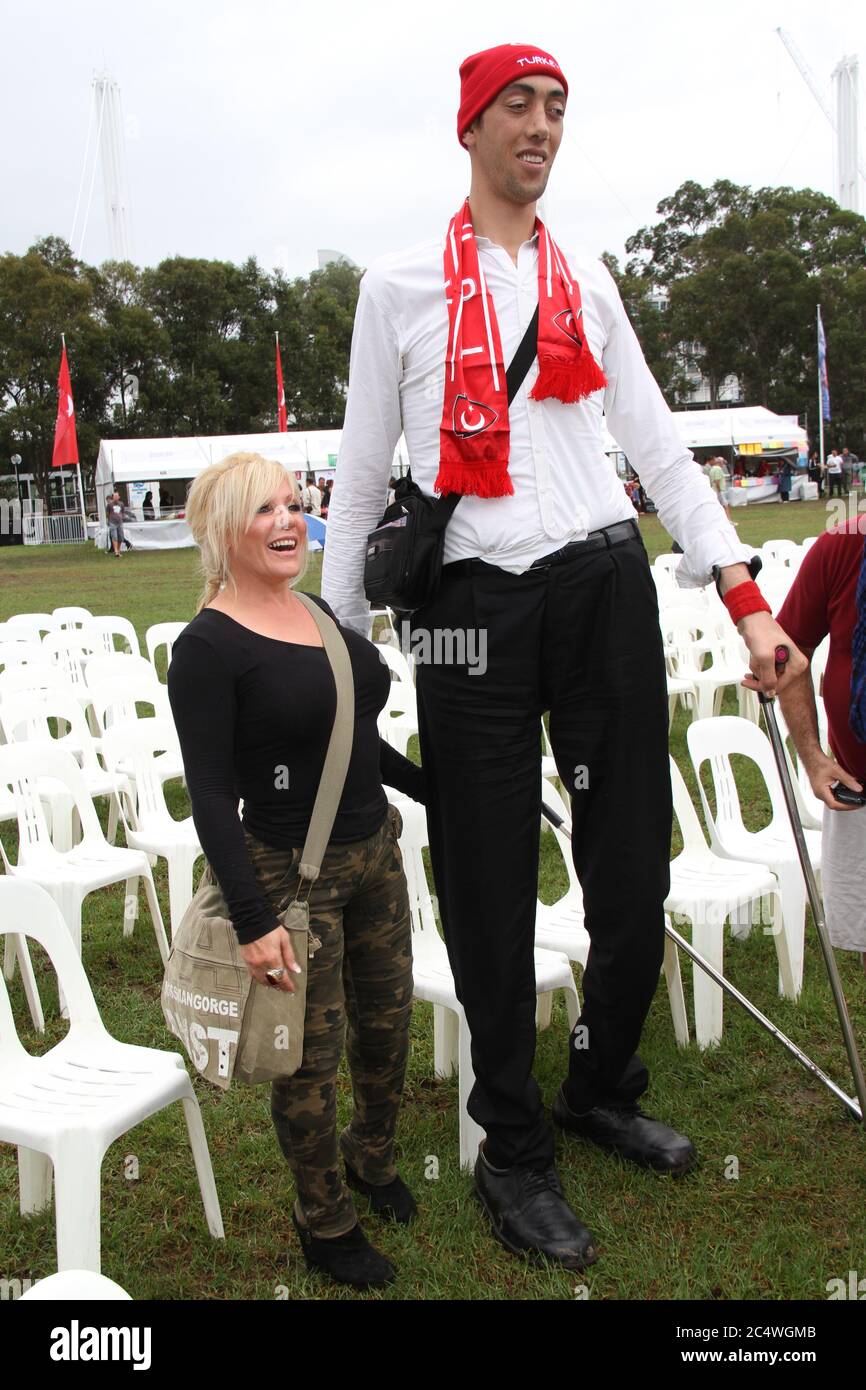 People have their photo taken with the world’s tallest man, Sultan Kosen from Turkey at the Anatolian Turkish Festival in Sydney. Stock Photo