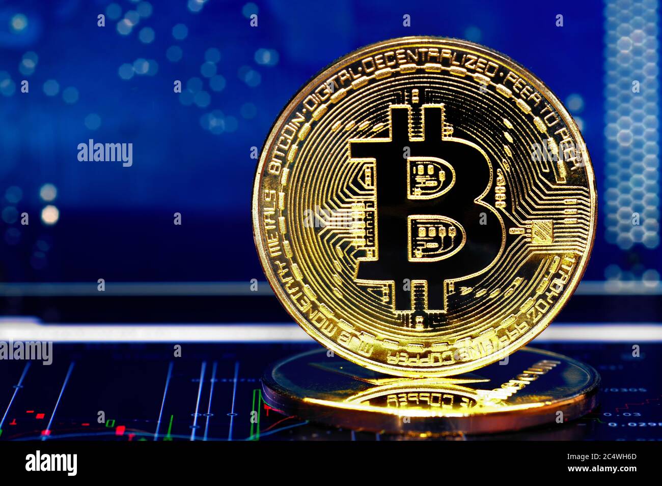 Bitcoin. Crypto currency Bitcoin, BTC, Bit Coin. Macro shot of Bitcoin  golden coin on blue background and chart under. Blockchain Stock Photo -  Alamy