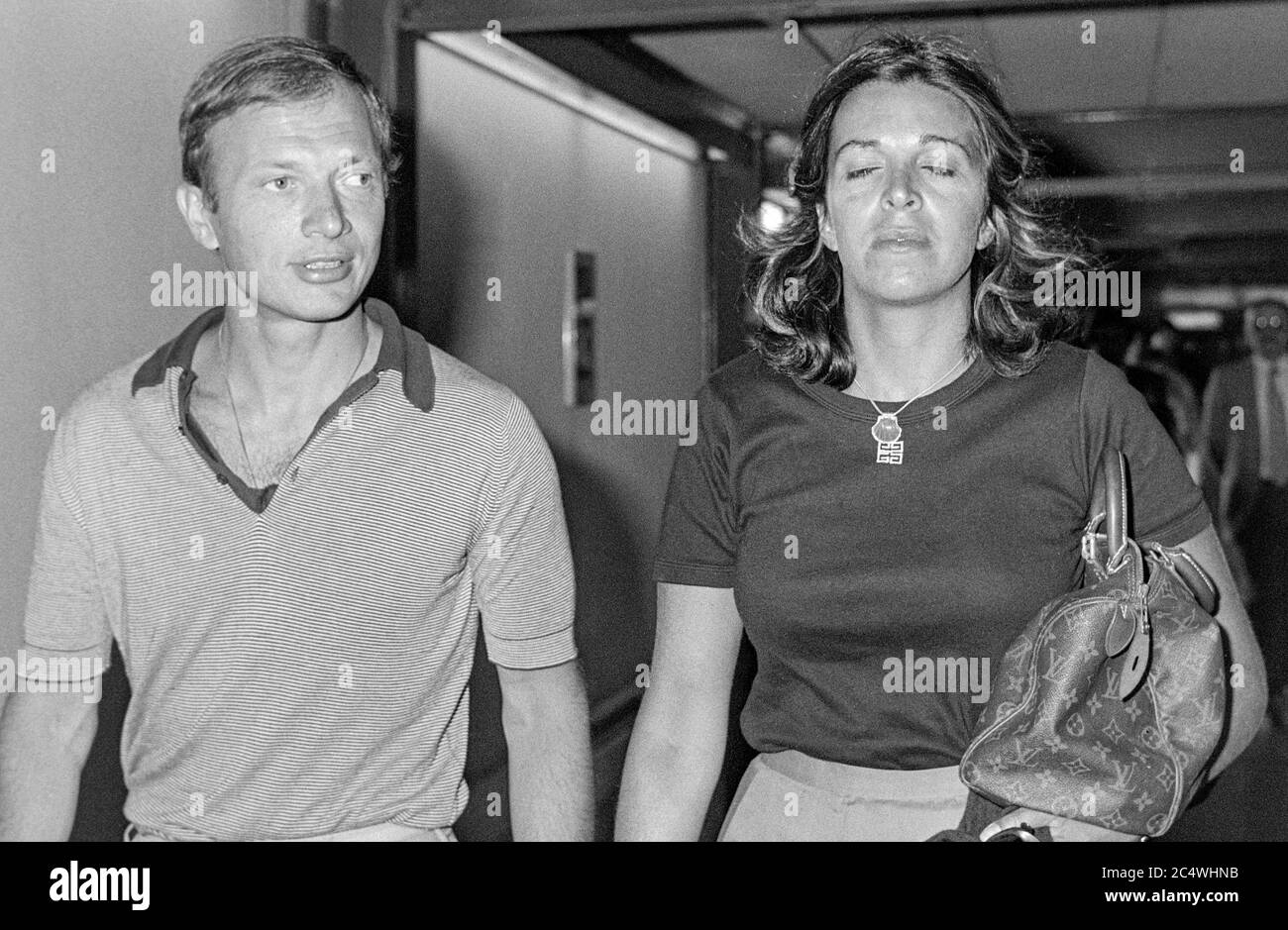 Greek socialite and business woman and heiress to the Onassis fortune Christina Onassis leaving London's Heathrow Airport with husband Sergei Kauzov in September 1979. Stock Photo