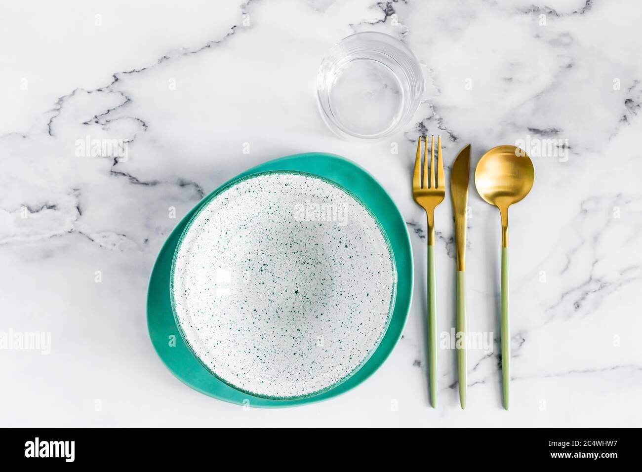 Stylish elegant table setting with ceramic plates on white marble background, top view Stock Photo