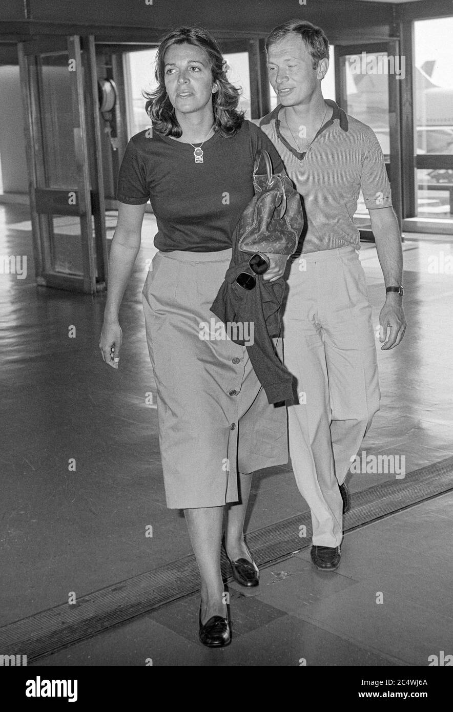 Greek socialite and business woman and heiress to the Onassis fortune Christina Onassis leaving London's Heathrow Airport with husband Sergei Kauzov in September 1979. Stock Photo