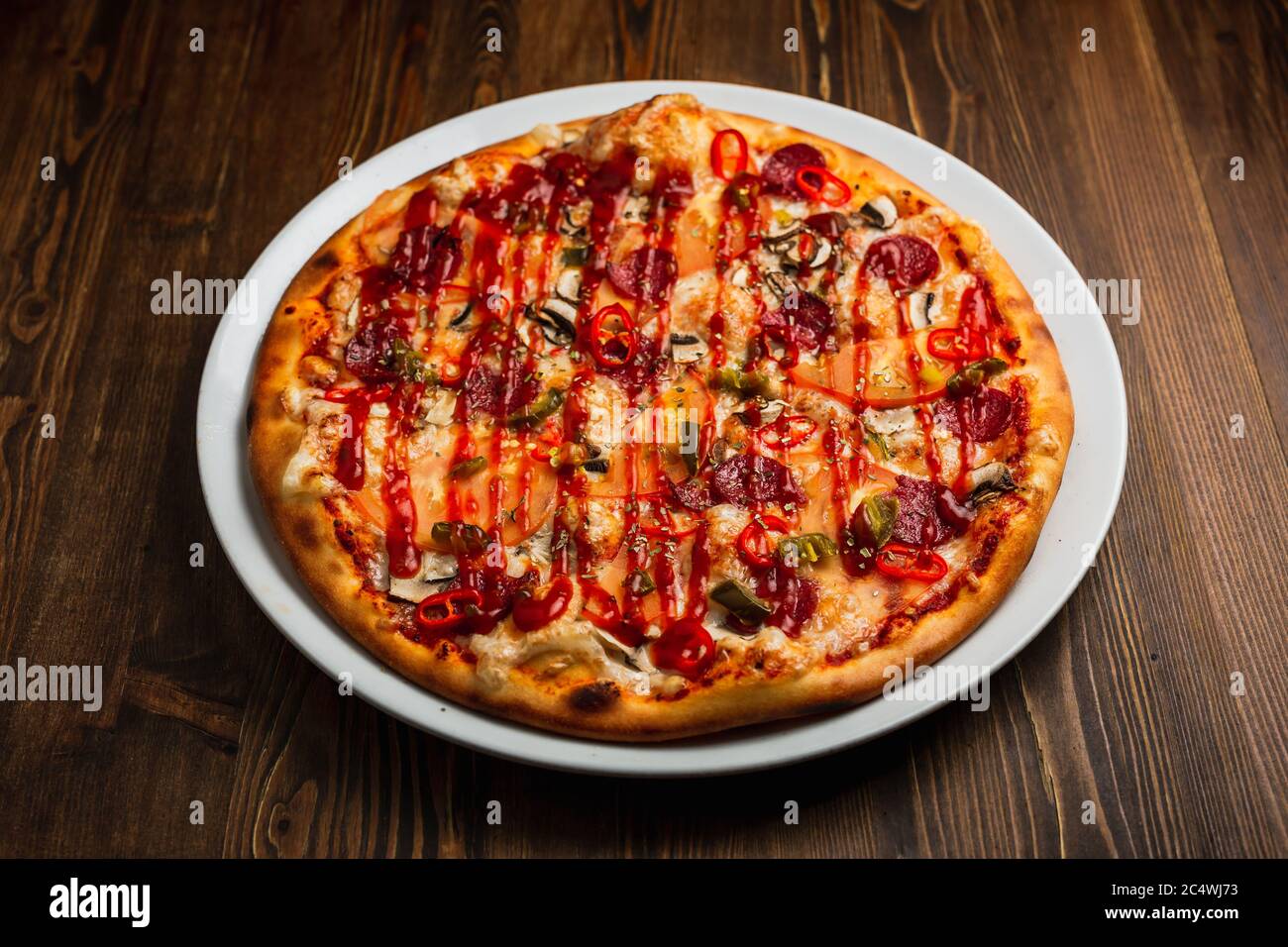 Pepperoni, mushroom, tomato, jalapeno and chili pepper and cheese spicy