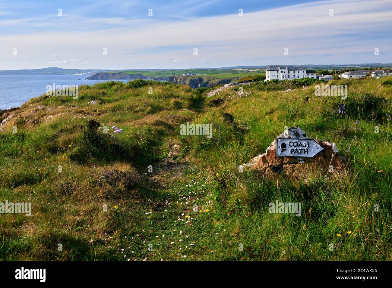 The South West Coast Path on cliffs above Mullion Cove on the Lizard Penisula in Cornwall Stock Photo