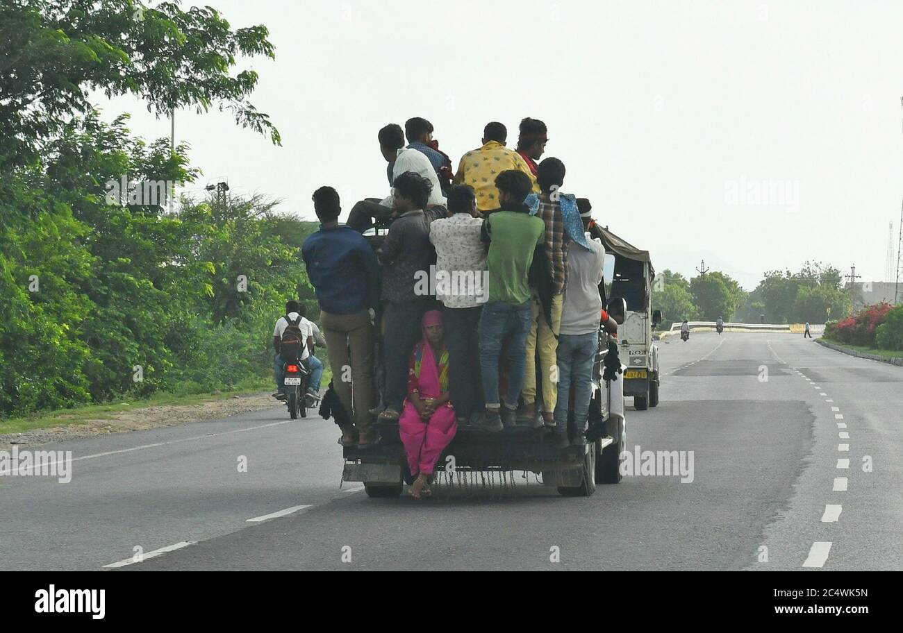 Beawar, Rajasthan, India, June 29, 2020: People travel in an overloaded private taxi on national highway 8 during Unlock 1.0 in Beawar. Drivers are putting the life of passengers to risk by overloading vehicles due to not running regular government bus. Credit: Sumit Saraswat/Alamy Live News Stock Photo