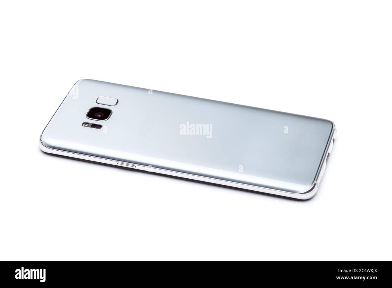 Smartphone is the rear side view, view of the back of the phone with a camera, flash and a fingerprint scanner in a glass case, isolated on a white ba Stock Photo