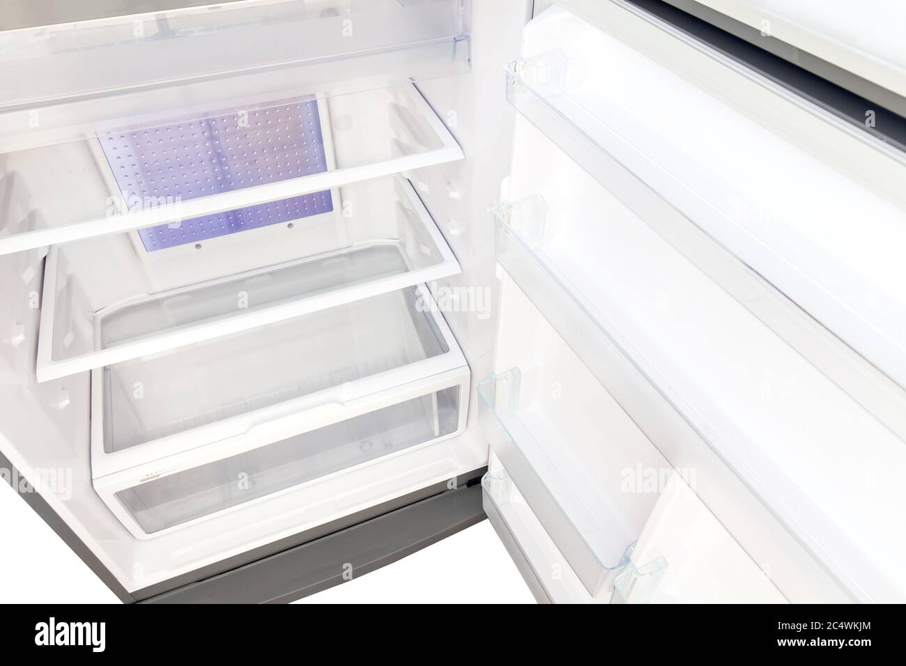 https://c8.alamy.com/comp/2C4WKJM/the-refrigerator-empty-glass-shelves-and-a-tray-for-vegetables-top-view-inside-the-refrigerator-2C4WKJM.jpg
