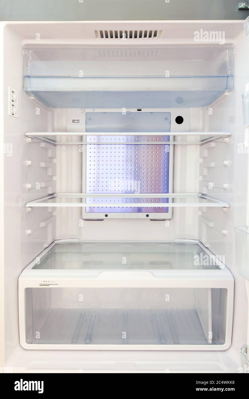 Refrigerator with empty shelves, food refrigerator in white with glass