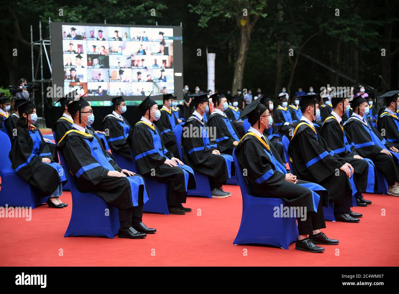 Beijing, China. 29th June, 2020. Graduates attend the commencement ceremony at Beihang University in Beijing, capital of China, June 29, 2020. Beihang University held a commencement ceremony for the Class of 2020 (Bachelor's Degrees) on Monday. In order to reduce the risk of infection of COVID-19, only a minority of graduates attended the ceremony on site with the others attending online. Credit: Ren Chao/Xinhua/Alamy Live News Stock Photo